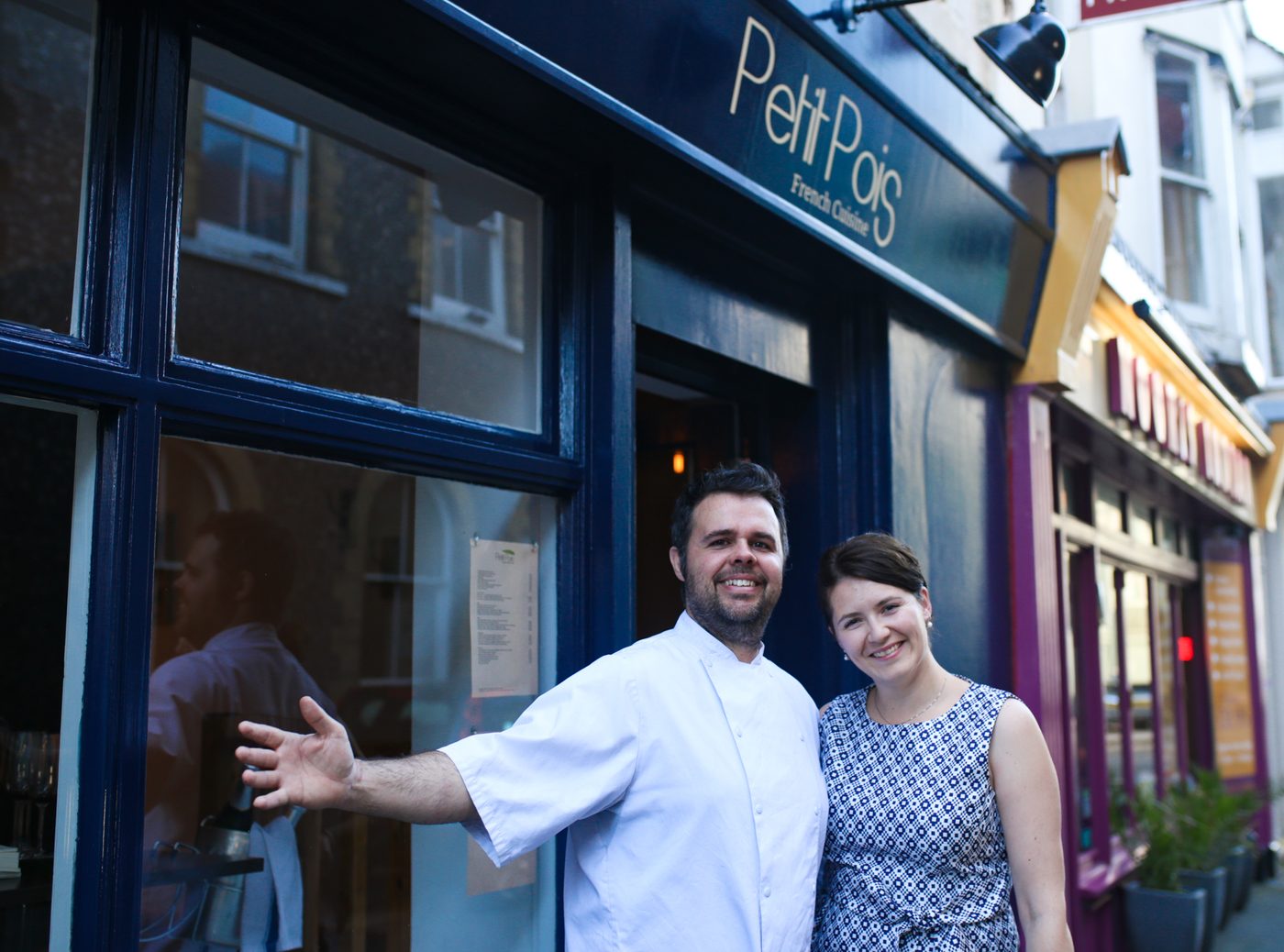 Chef David Roy and Ivana Roy outside the navy frontage of Petit Pois